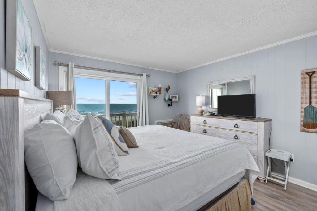 Windy Hill House | Direct Beach Access. Pets welcome. Oceanfront Condo with Pool - Stunning Views