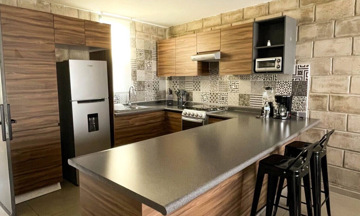 Downtown Guadalajara Apartment | Elegante loft urbano con acceso a gimnasio y salas de trabajo.