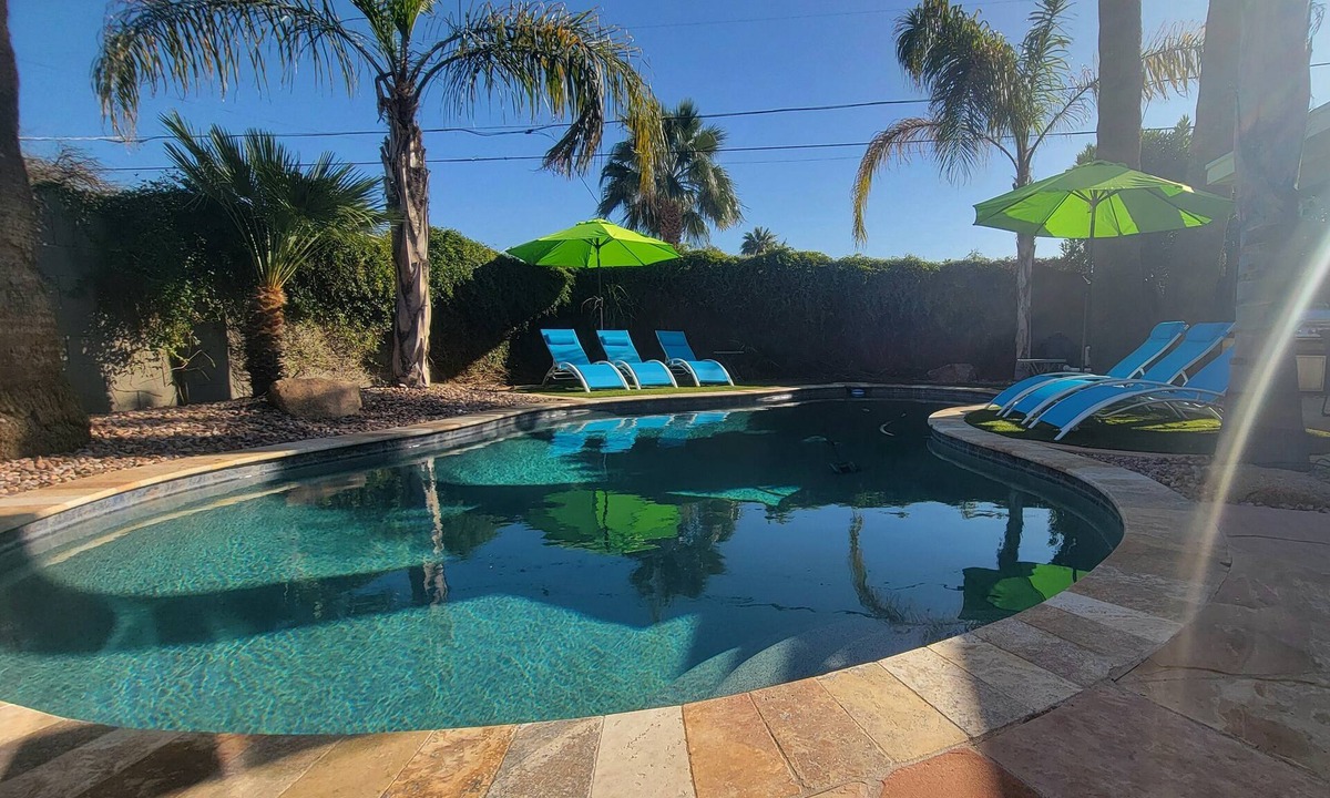 South Scottsdale House | Old Town Scottsdale modern decor big pool hot tub TV on patio Comfort Convenient