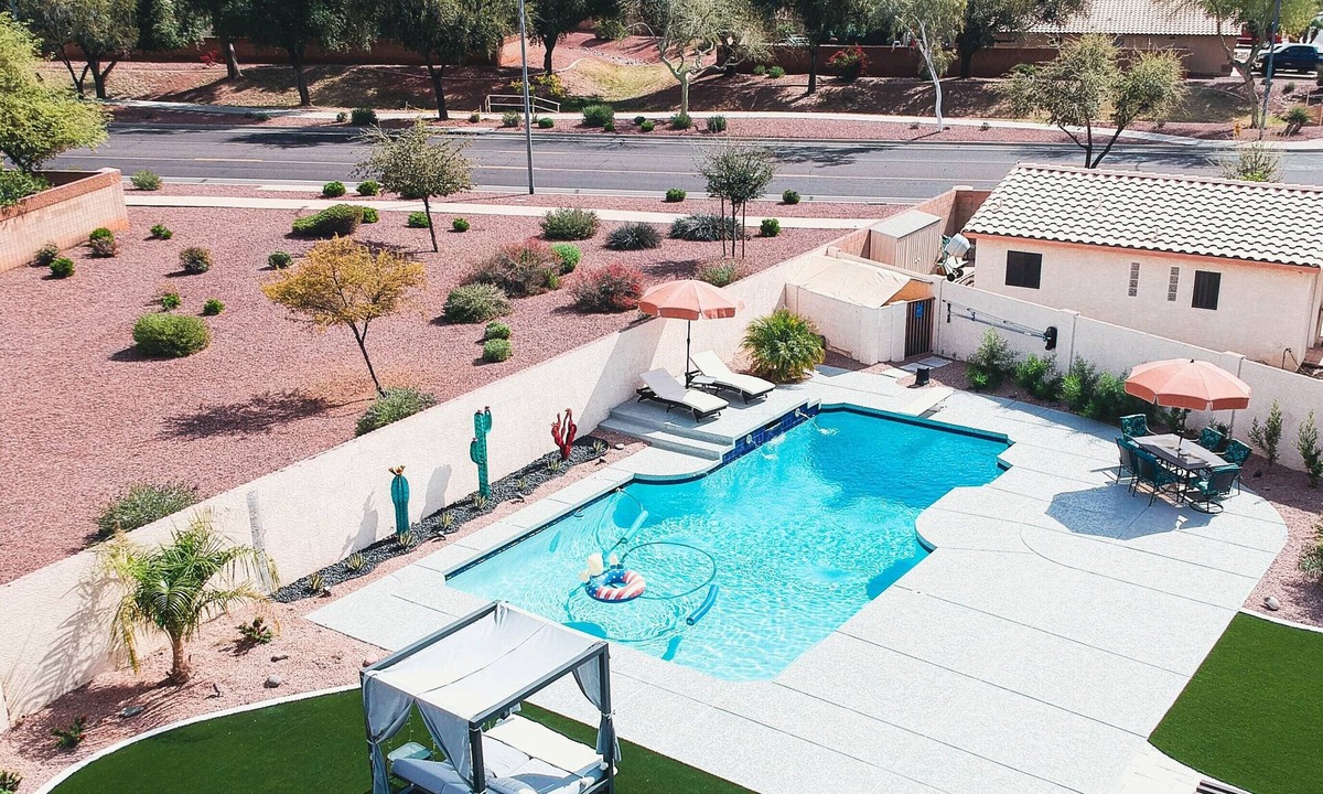 Avondale House | Relax in private heated hot tub or just bask in the sun by the pool.