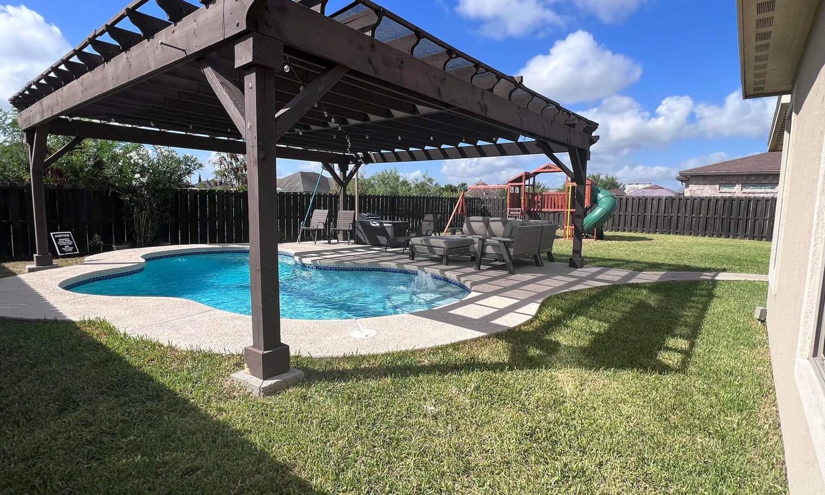 Brownsville House | Stately retreat with backyard oasis - pool, inviting patio - plus modern kitchen