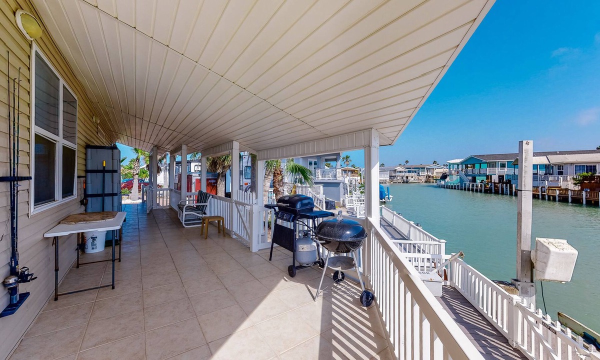 Port Isabel House | Waterfront home with views of channel, expansive covered deck, & 2 pools