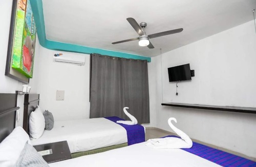 Avenida Tulum Hotel | 4 Rooms w/2 Double Beds Each + Free Parking | Explore Cancún's Attractions!