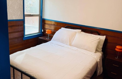 The Village Hotel | Arkouda Cabins: Lazuli Bunting