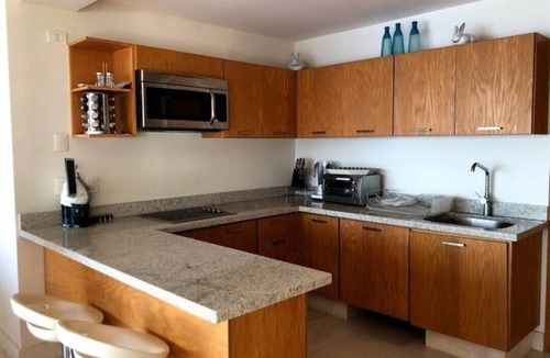 Peninsulas de Santiago Apartment | Beachfront apartment in Ponto Horizonte.