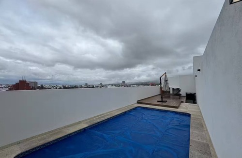 San Luis Potosi Apartment | Carranza Views! Heated Pool, KingBed & WorkSpace