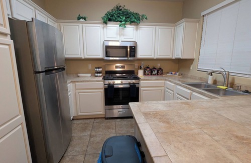 Bell West Ranch House | Cozy Surprise Desert Oasis Kitchen & 4 Bedrooms w/AC. Group & Pet-Friendly!
