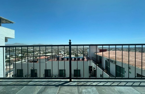 Downtown Cabo San Lucas Apartment | Dog-friendly loft with rooftop infinity pool, gym, balcony, & central AC