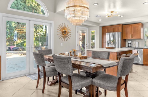 Corona House | Enjoy a comfortable 3-bedroom home in Corona featuring a private pool with a waterslide, outdoor kitchen, fire pit, and dedicated workspaces. Designed for 30+ day stays, this home is ideal for relocation guests, insurance housing, corporate travelers