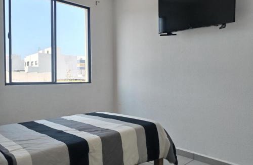 Queretaro House | House A in a residential condominium with a pool