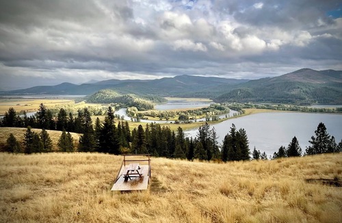 Harrison Cabin | Idaho Getaways Beautiful Glamp tent with lakeview of Lake Coeurdalene & campfire