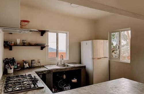 Compostela House | La Casa Chilam - A hidden hillside retreat. Close to beaches and Pet Friendly!