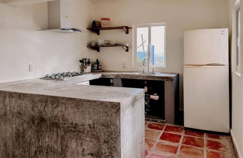 Compostela House | La Casa Chilam - A hidden hillside retreat. Close to beaches and Pet Friendly!