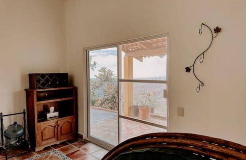 Compostela House | La Casa Chilam - A hidden hillside retreat. Close to beaches and Pet Friendly!