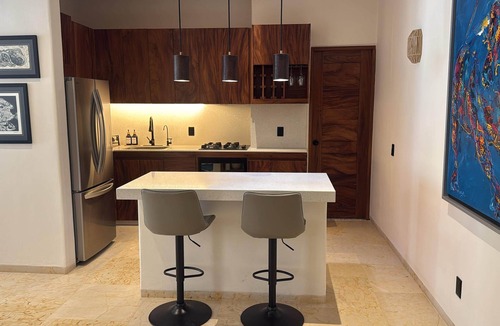 Zihuatanejo Villa | Luxurious 2 bedroom condo Steps from Beach with ocean view from balcony.