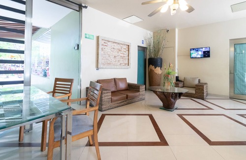 Gonzalo Guerrero Condo | Modern condo with patio and balcony overlooking 5th Ave. 4 minute walk to beach!