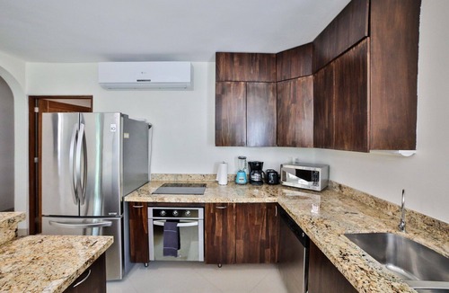Gonzalo Guerrero Condo | Modern Condo w/ Large Private Patio on 5th Avenue. 4 min. Walk to the Beach!