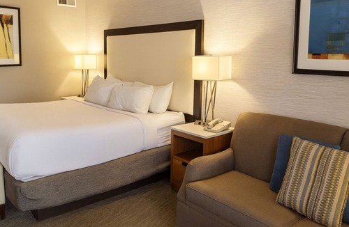 Downtown Resort | Modern King Unit with Sunset Views! Pool, Parking, Dining, and Gym Access!