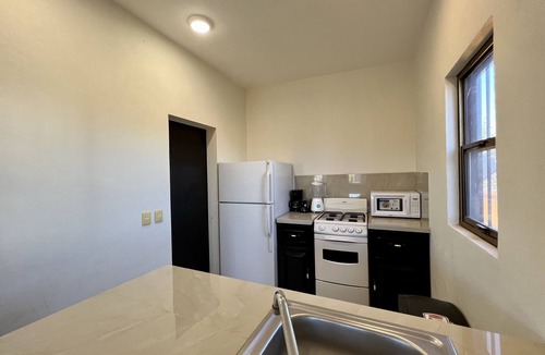 San Carlos House | One lot with main house, casita, and large green yard