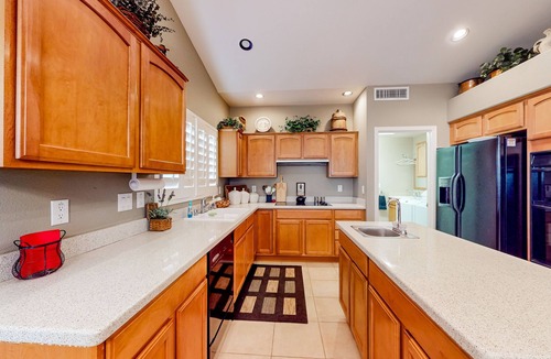 Oakwood House | Palm-lined home with pool access, grill, office & golf course views
