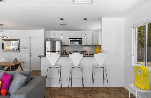 Desert Park Estates House | Palm Paradise offers a private 3BR retreat with a saltwater pool, fire pit, BBQ, and mountain views. Just minutes from downtown, this stylish getaway is perfect for families or friends seeking relaxation and Palm Springs charm.