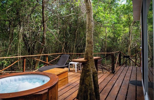 Akumal Cabin | Peaceful Getaway in the Jungle with AC and private deck with Hot Tub.