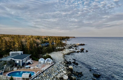 Hunts Point Cottage | Relaxing Oceanfront Retreat . Hot tub -sauna-pool-clear domes-private
