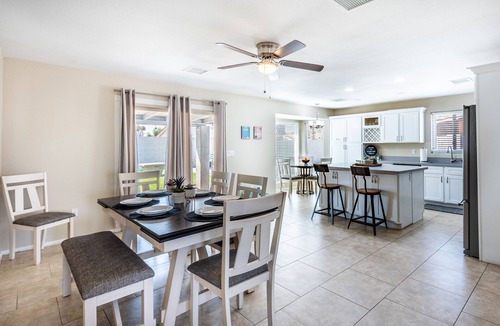 Phoenix House | Resort Style Backyard- Heated Pool, Putting Green, Outdoor TV and Pool Table.