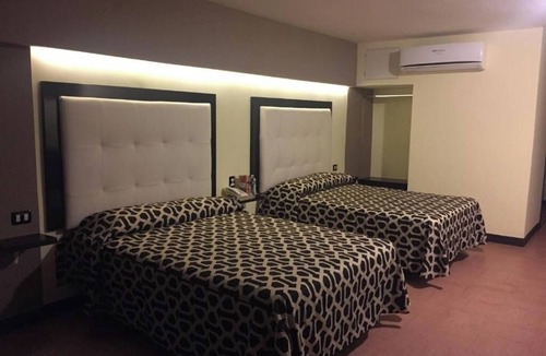 Mazatlan Hotel | Seaside Retreat: Comfortable Room with Clean Beds and Panoramic Ocean Views