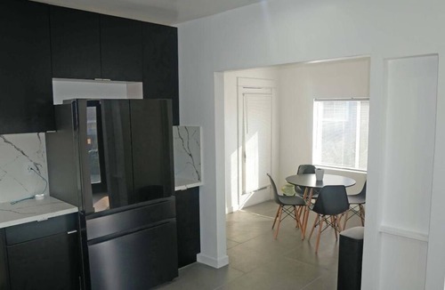 Mid City House | Spacious 4BR Home w/Gym, Fireplace & Prime LA Location. Near USC & Crypto Arena