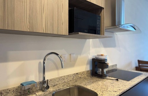 Zona Dorada Apartment | Steps from the beach, rooftop pool with grill