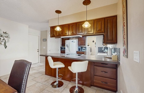 Sunland Village House | Sunny home with covered patio, grill, pool, tennis, hot tub, full kitchen, & AC