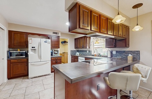 Sunland Village House | Sunny home with covered patio, grill, pool, tennis, hot tub, full kitchen, & AC