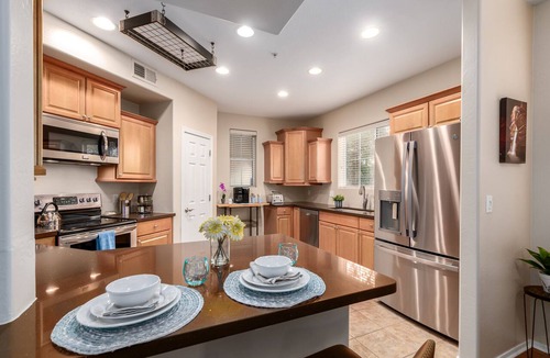 Park Place Condo | Surprise Ground Floor Condo with 2 Private Courtyards! Heated Community Pool!