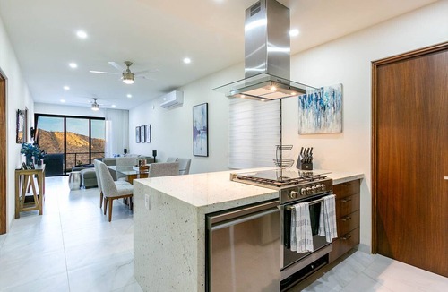 Libertad Condo | This brand-new 2-bedroom, 2-bath condo offers modern comfort with a stylish open layout and fully equipped kitchen. Enjoy a private rooftop terrace with outdoor kitchen and panoramic views—perfect for relaxing and taking in the beauty of Vista Mare.