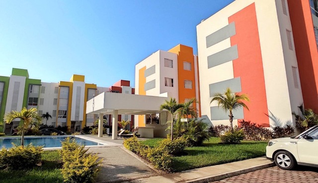 8 minutes from the beach! Family apartment with pool & gardens in private gated community