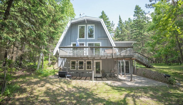 A-frame cabin with sandy swimming beach, 4 bedrooms, and amenities of home.