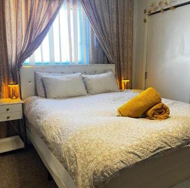 Boutique Elegant Gold Room Kitchenette With EV Charger
