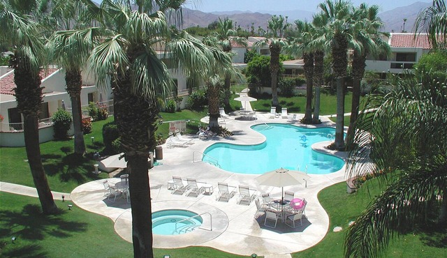 Breathtaking mountain views from this very private, updated Mid Century condo!