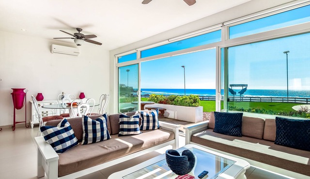Cheerful dog-friendly villa with beach views, outdoor pool, private patio, & AC
