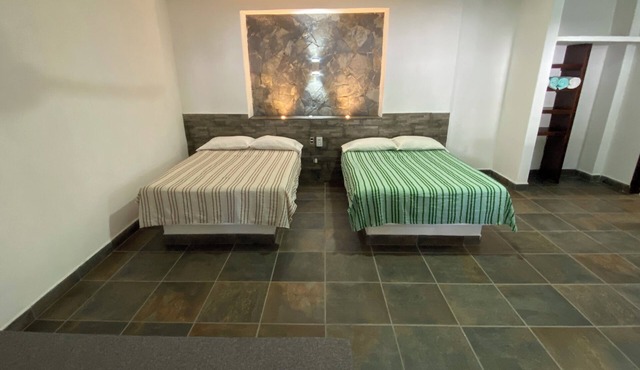Costa Ayala suite 1 with 2 dbl bed and 2 sofas, all basics, 2 blocks from beach