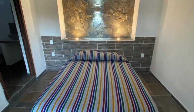 Costa Ayala suite 9 with 1 QS bed and 2 sofas, all basics, 2 blocks from beach