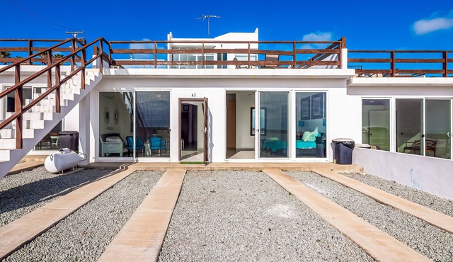 Dog-friendly beachfront villa with pool & hot tub access plus rooftop deck