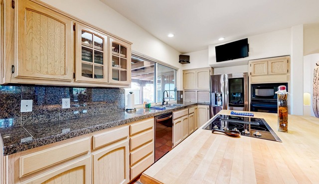 Dog-friendly oasis home with a private pool, pool spa, putting green, & W/D