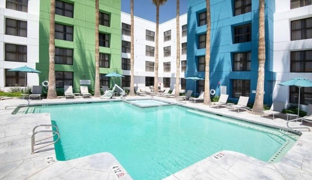 Eco-Certified Guest Room with Heated Pool, On-Site Dining, and Easy I‑10 Access