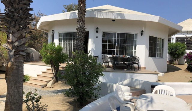 Gorgeous house in a neighbourhood surrounded by palm trees.