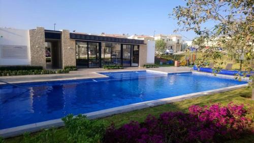 House A in a residential condominium with a pool