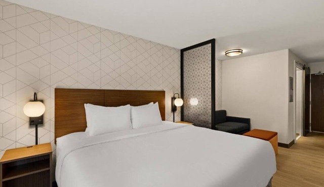 One Suite w/King Size Bed | Kitchenette | Gym Access | Free Parking