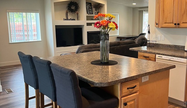 Open floor plan with a covered patio and fenced yard. in Millcreek