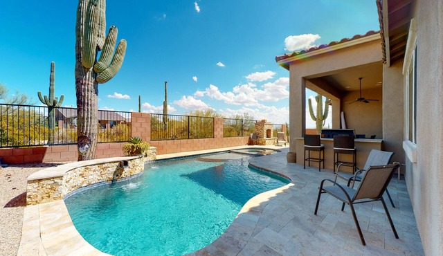 Southwestern stunner with enclosed yard, pool, putting green, & grill